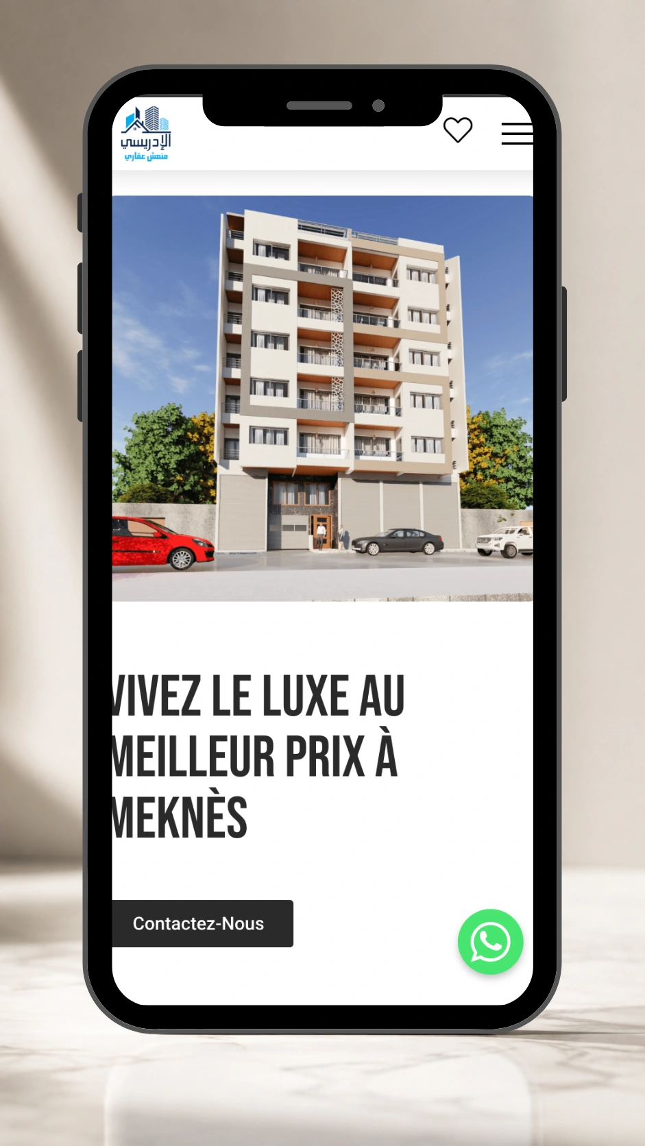 Promoteur Idrissi Real Estate Website project displayed in a mobile phone mockup.